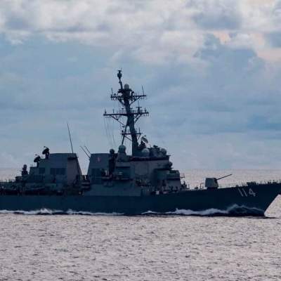 US Navy warship challenges China in South China Sea as US blasts Beijing's 'unlawful' claims and 'gangster tactics