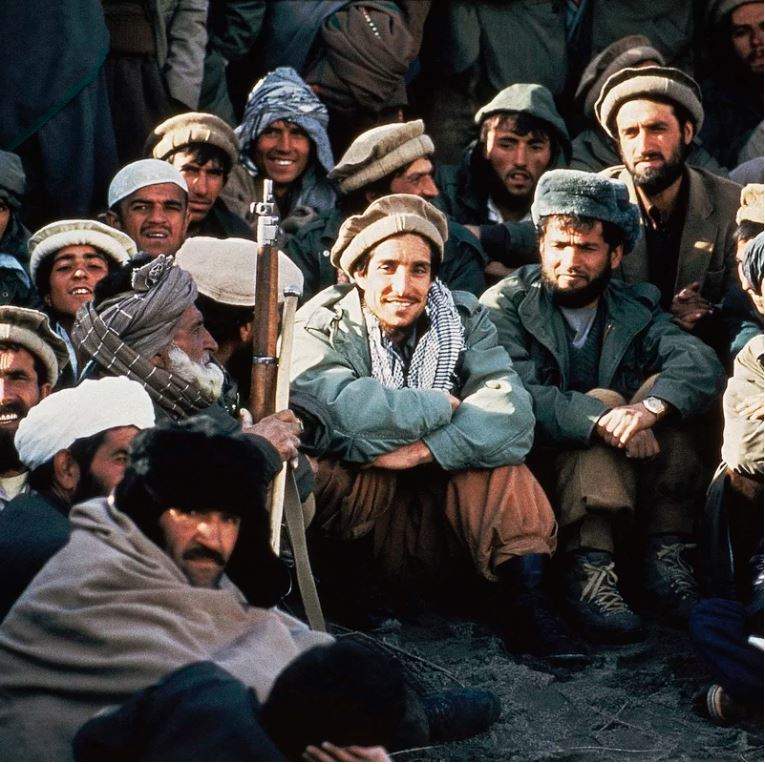 Afghan guerrilla leader, Ahmad Shah Massoud (center) is surrounded by rebel commanders at a meeting in the Panjshir Valley in northeast Afghanistan, in 1984. Jean-Luc Bremont/AP