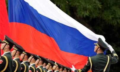 An honour guard holds a Russia flag during preparations for a welcome ceremony for Russian President Vladimir Putin outside the Great Hall of the People in Beijing, China, on June 8, 2018. (Jason Lee/Reuters)