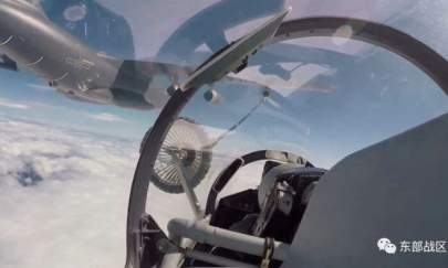 An air force aircraft under the Eastern Theater Command of China's People's Liberation Army (PLA) gets refueled mid-air during military exercises in the waters around Taiwan, in this screengrab from an Aug. 4 video released on Aug. 5, 2022. (Eastern Theater Command/Handout via Reuters)