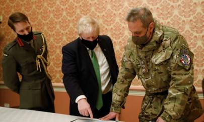 UK Prime Minister Boris Johnson attends a military briefing with Col. James HF Thurstan, commander of Operation Orbital, in Kyiv, Ukraine, on Feb. 1, 2022. (Peter Nicholls/PA)