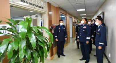 South Korean Air Force chief of staff Gen. Park In-ho, second from right in the front row, and other senior air force officers stand in front of the Space Center that opened Sept 30 at Air Force headquarters in Gyeryong, South Chungcheong Province. Credit: South Korean Air Force