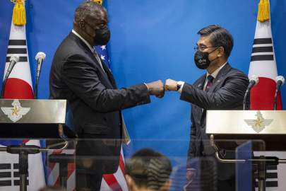 Secretary of Defense Lloyd J. Austin III and South Korean Minister of Defense Min Suh bump fists at the conclusion of a press conference at the 53rd U.S.-Republic of Korea Security Consultative Meeting (SCM) at the Defense Ministry in Seoul, Republic of Korea, Dec. 2, 2021. DOD photo by Chad J. McNeeley