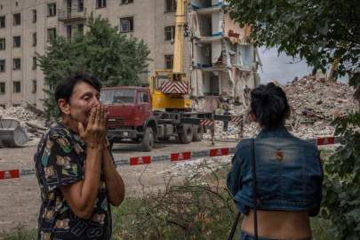 Nariman El-Mofty, AP Iryna Shulimova, 59, weeps at the scene in the aftermath of a Russian rocket that hit an apartment residential block, in Chasiv Yar, Donetsk region, eastern Ukraine, Sunday, July 10, 2022. At least 15 people were killed and more than 20 people may still be trapped in the rubble, officials said Sunday.