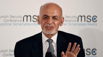 Afghan President Ashraf Ghani. speaks on the second day of the Munich Security Conference in Munich, Germany, Saturday, Feb. 15, 2020. (AP Photo/Jens Meyer)