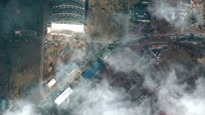 This satellite image provided by Maxar Technologies shows the aftermath of combat with grass fires and damage caused by recent airstrikes and heavy fighting with the Russians in and near the Antonov Airport, in Hostomel, Ukraine, Sunday, Feb. 27, 2022. (Satellite image ©2022 Maxar Technologies via AP)