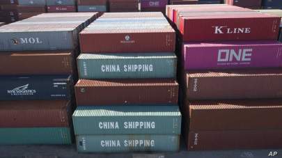 FILE - China Shipping Company containers are stacked at the Virginia International