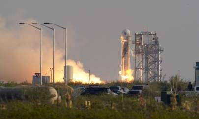 Blue Origin's New Shepard rocket launches carrying passengers Jeff Bezos, founder of Amazon and space tourism company Blue Origin, brother Mark Bezos, Oliver Daemen and Wally Funk, from its spaceport near Van Horn, Texas, on July 20, 2021. (Tony Gutierrez/AP Photo)