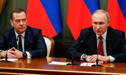 Russian President Vladimir Putin (R) and deputy security council chief Dmitry Medvedev meet with members of the government in Moscow, Russia, on Jan. 15, 2020. (Dimitry Astakhov/Sputnik/AFP via Getty Images)