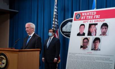 Deputy Attorney General Jeffery Rosen speaks to the media about charges and arrests related to a computer intrusion campaign tied to the Chinese regime by a group called APT 41 at the Department of Justice in Washington, on Sept. 16, 2020. (Tasos Katopodis-Pool/Getty Images)