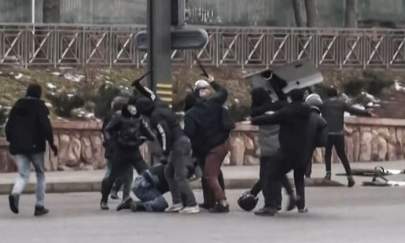 A frame grab taken on Jan. 6, 2022 from an AFPTV video made on Jan. 5, 2022, shows protesters clashing with Kazakhstan's security forces during a demonstration in the country's largest city Almaty as unprecedented unrest in the Central Asian nation spins out of control due to a hike in energy prices. (ALEXANDER PLATONOV/AFPTV/AFP via Getty Images)