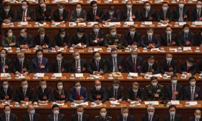 Delegates take part in the closing session of the Chinese People's Political Consultative Conference (CPPCC) at the Great Hall of the People in Beijing on March 10, 2022. (Kevin Frayer/Getty Images)