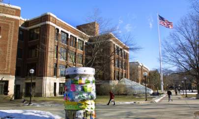 Students walk across the University of Michigan campus in Ann Arbor, Michigan. The university is one of five that reportedly has undisclosed ties with a leading Chinese military research university sanctioned by the U.S. (Bill Pugliano/Getty Images)