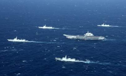 A Chinese navy formation, including the aircraft carrier Liaoning (C), during military drills in the South China Sea, on Jan. 2, 2017. (STR/AFP via Getty Images)