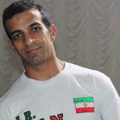 Iran Powerlifter Flees For His Life After Regime Demands He Wears T-Shirt of Terrorist Soleimani