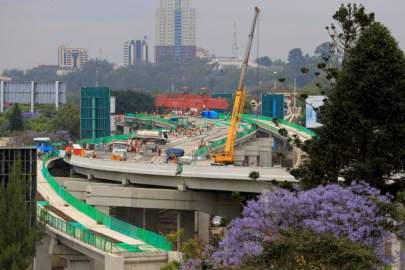 Workers are seen on site during the construction of the Nairobi Expressway, undertaken by the China Road and Bridge Corporation (CRBC) on a public-private partnership (PPP) basis, along Uhuru Highway in Nairobi, Kenya October 20, 2021. Picture taken October 20, 2021. REUTERS/Thomas MukoyaREUTERS