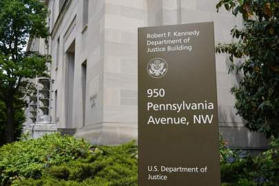 This May 4, 2021 file photo shows a sign outside the Robert F. Kennedy Department of Justice building in Washington. The Russian hackers behind the massive SolarWinds cyberespionage campaign broke into the email accounts some of the most prominent federal prosecutorsâ€™ offices around the country last year, the Department of Justice said Friday, July 30, 2021. PATRICK SEMANSKY/AP