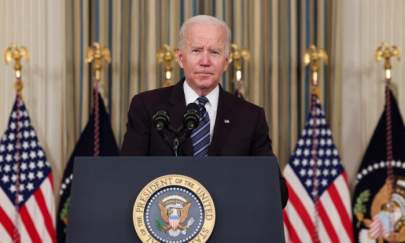 President Joe Biden looks on as he delivers remarks on the October jobs report at the White House in Washington, on Nov. 5, 2021. (Evelyn Hockstein/Reuters)