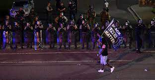 Black Lives Matter supports the same anti-freedom agenda in America as it does in Cuba. Pictured: Police officers stand guard during a June 24 protest after the arrest of Ricky and Travis Price in Rock Hill, South Carolina. (Photo: Peter Zay/Anadolu Agency/Getty Images)