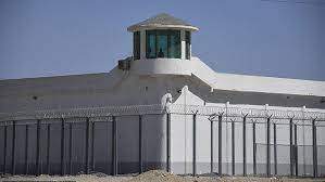 AFP Via Getty Images - The internment camps are estimated to house three million Kazakhs and Uyghurs who are subjected to medical experiments, rape and torture. Pictured is a watchtower at what is believed to be a 'red-education camp' on the outskirts of Xingiang