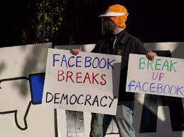 © Provided by Business Insider Protestor in front of Facebook sign Jeff Chiu/AP Photo