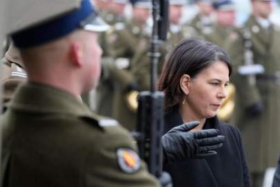 German Foreign Minister Annalena Baerbock attends a wreath-laying ceremony at the tomb of the Unknown Soldier in in Warsaw, Poland, Friday, Dec. 10, 2021. Germany has found itself facing a series of challenges in its relations with Russia and China since taking office last month that are testing the new government’s foreign policy mettle. Among them are Moscow’s military build-up near Ukraine and the diplomatic fallout from a court verdict finding that the Russian government was behind the 2019 killing of a Chechen dissident. (AP Photo/Czarek Sokolowski, File)