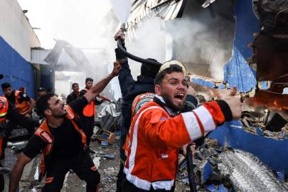 Palestinian firefighters doused a fire at a mattress factory following an Israeli airstrike on Monday in the northern Gaza Strip. PHOTO: MAHMUD HAMS/AGENCE FRANCE-PRESSE/GETTY IMAGES