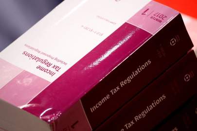 Copies of tax regulations during a markup on the Tax Cuts and Jobs Act on Capitol Hill, Nov. 15, 2017. PHOTO: AARON BERNSTEIN/REUTERS