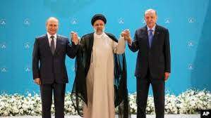 AP - Russian President Vladimir Putin, left, Iranian President Ebrahim Raisi, center, and Turkish President Recep Tayyip Erdogan pose for a photo prior to their talks at the Saadabad palace, in Tehran, Iran, July 19, 2022.