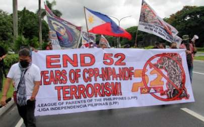 ANTI-TERRORISM. League of Parents of the Philippines and Liga Independencia Pilipinas members hold a rally along University Avenue in Quezon City on Monday (July 19, 2021). They denounced the recruitment of students into the Communist Party of the Philippines-New People