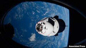 Associated Press - FILE - In this April 24, 2021 photo made available by NASA, the SpaceX Crew Dragon capsule approaches the International Space Station. 