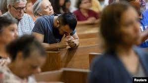 Reuters - Worshipers gather for Mass at the Sacred Heart Catholic Church a day after a gunman killed 19 children and two teachers at Robb Elementary in Uvalde, Texas, U.S. May 25, 2022.