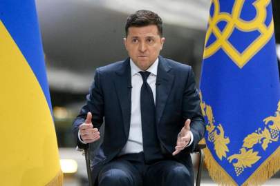 Ukrainian President Volodymyr Zelenskyy gestures while speaking to the media during a news conference with the world's largest airplane, Ukrainian Antonov An-225 Mriya in the background at the Antonov aircraft factory in Kyiv, Ukraine, Thursday, May 20, 2021. (AP Photo/Efrem Lukatsky) THE ASSOCIATED PRESS