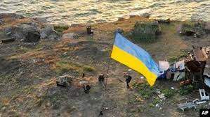 AP - In this photo provided by the Ukrainian Defense Ministry Press Office, July 7, 2022, Ukrainian soldiers hoist the national flag on Snake Island, in the Black Sea. The outpost had been under the control of Russian troops for much of the war.