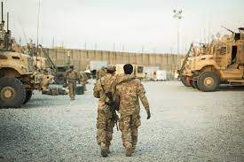 A U.S. soldier from the 3rd Cavalry Regiment walks with the unit's Afghan interpreter  before a mission (Reuters) Dec 11,2014